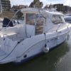 Bateau moteur occasion Quicksilver weekend 700 vue arriere tribord scaled