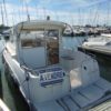 Bateau moteur occasion Quicksilver weekend 700 vue jupe arriere scaled