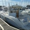bateau moteur occasion Quicksilver weekend 700 vue arriere babord scaled